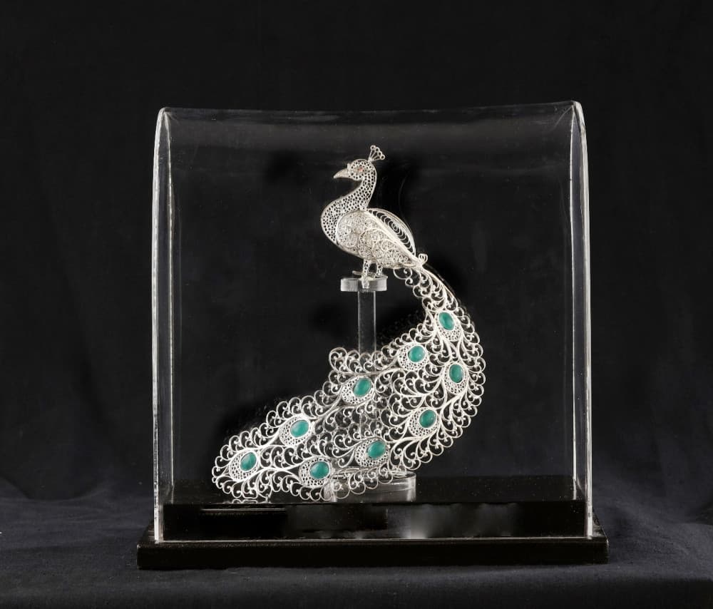 A silver filigree peacock from Karimnagar