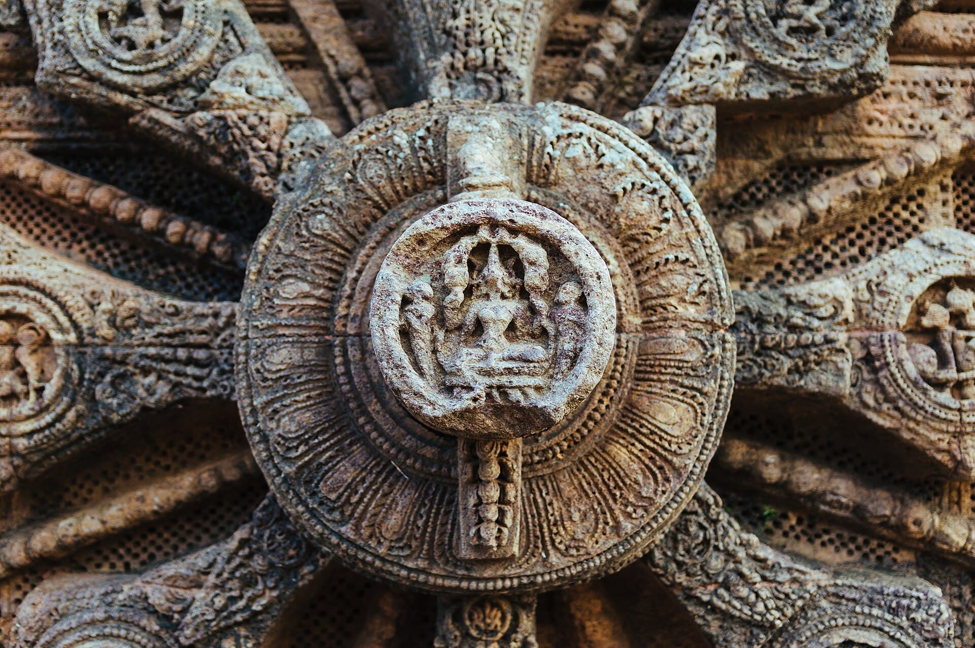 Close-up of the carved hub of a Konark wheel